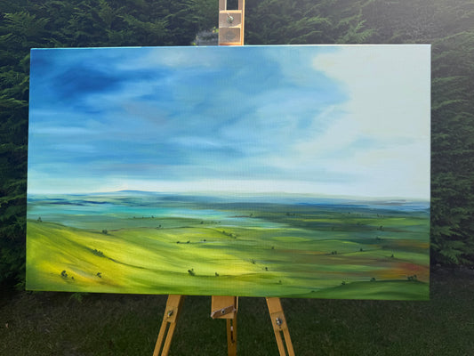 Breathe original oil landscape painting of rolling green hills under a dramatic blue and white sky by Caroline Manson