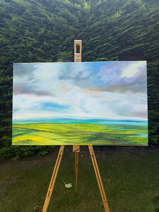 Peace original oil landscape painting of rolling green fields under a moody, dramatic grey and purple storm sky by Caroline Manson